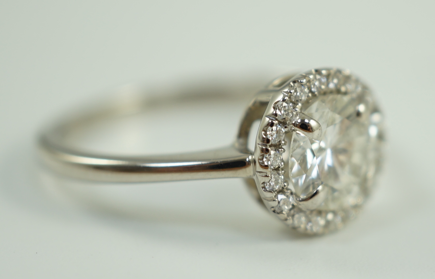 An 18ct white gold and diamond cluster ring